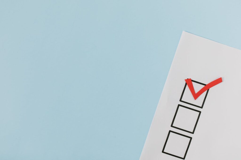 Red check mark on a box list representing an ERP implementation checklist